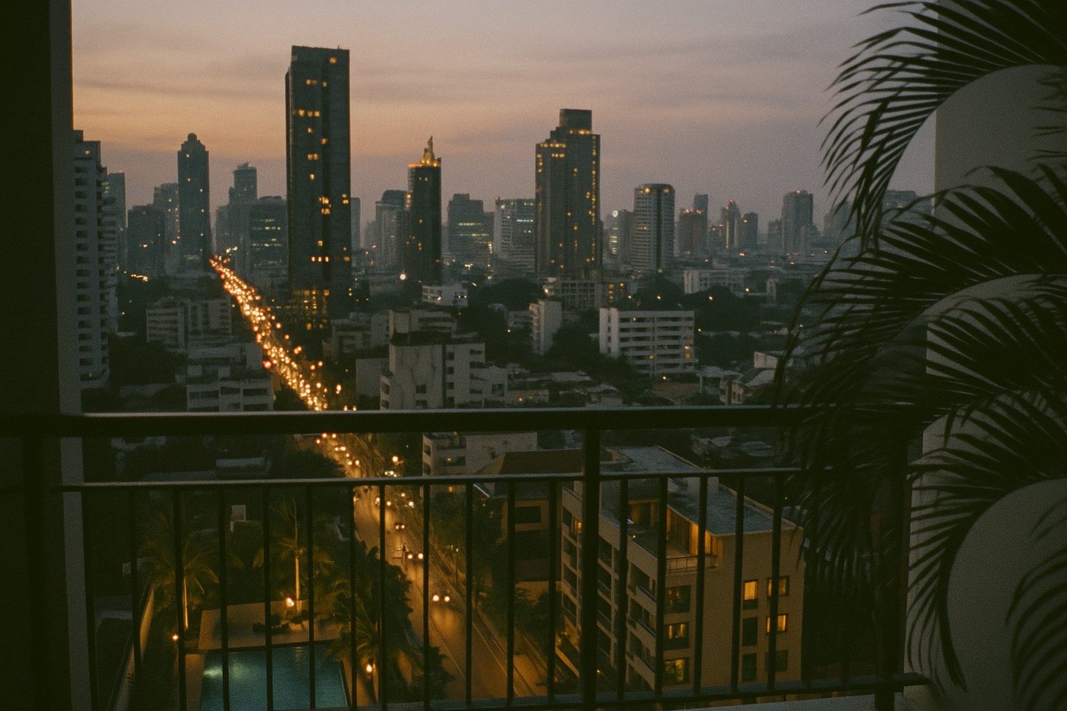 Evening view over Bangkok from a condo balcony